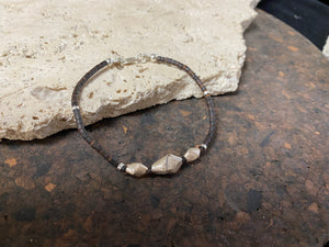 One of our signature coconut silver bracelets, crafted from polished coconut wood and hill tribe 95% silver., with sterling silver lobster clasp. A women's bracelet or a men's bracelet, it has a casual Boho vibe, and is made for that stacked bracelet look. Different sizes available