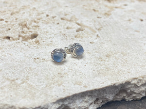 Simple and elegant, these small rainbow moonstone earring studs are hand made from sterling silver and set with natural rainbow moonstone cabochon stones