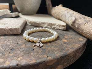 freshwatch pearl elasticized bracelet with sterling silver bead and charm