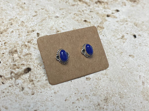 Simple and elegant, these small lapis lazuli earring studs are hand made from sterling silver and set with lapis cabochons