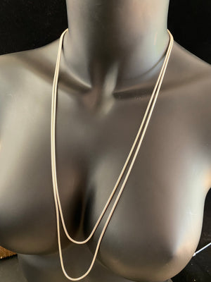 2.1 mm diameter snake chain in two lengths, these nickel-free chains are German-made from 93.5% silver and are tarnish-resistant. Our snake chain features a parrot clasp and is fitted with a narrow bail to ensure even the smallest of pendants will fit. Select Long 70 cm/28" or Very long - 80 cm/32"