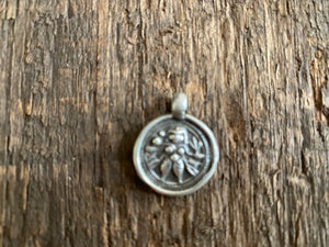 Antique silver amulets representing the Hindu god Kali, in her protective form, and dating from the early 19th - early 20th century. Measurements: all vary between 1.5 and 2.2 cm in width