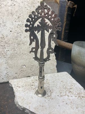 Ethiopian processional cross, hand cast by the lost wax method. Made from white metal and designed to be displayed and paraded in religious processions on top of wooden staffs, these are used vintage pieces dating to the 1970's, and are from the Lalibela region of northern Ethiopia. Height approximately 19.5 cm