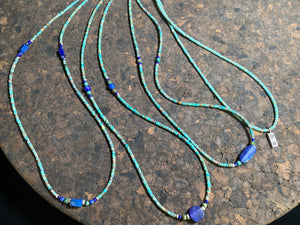 Fine beaded lapis and turquoise necklaces made from tiny tubes of turquoise, highlighted with lapis, African jasper and sterling silver. Our unisex necklaces are perfect for either men or women.