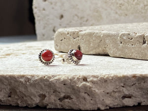Simple and elegant, these small red coral earring studs are hand made from sterling silver and set with bamboo coral cabochons