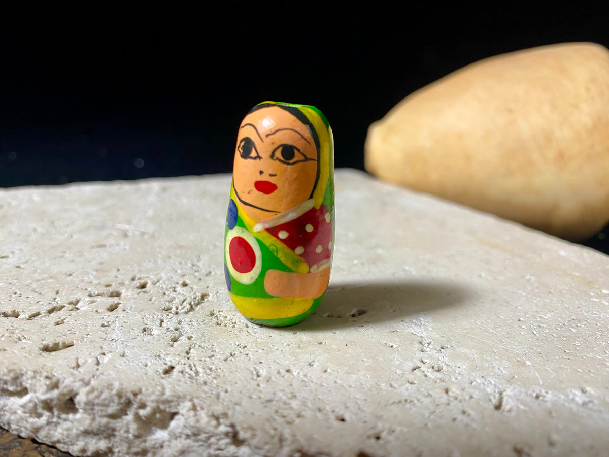 Novelty beads perfect for beading projects or as little doll statues. Made from lightweight wood and hand painted in the style of babushka dolls but with an Indian twist, our wood beads are great gifts for kids. Light enough to be worn as earrings. Perfect for a jewellery project. Height 2.6 cm, width 1.5 cm