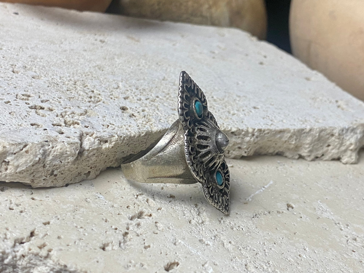 beautiful statement ring made by a Rajasthani village silversmith just outside of Jaipur. Sterling silver and blue ceramic beads with hand wired (not cast) filigree face decoration. Rajasthan, India. Looks great on a man's hand or woman's hand.   Measurements:  Face 4 cm x 2.5 cm Size 9.25 | 19.25 mm