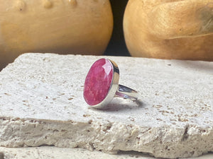  Our large facet cut ruby is set in a simple sterling silver bezel to show off the beauty and size of the stone. This is a statement ring that can be worn be either men or women.  Measurements:  Ruby 2 x 1.5 cm Size 8.5 | 18.75 mm