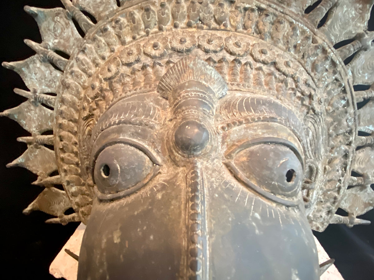 Ceremonial dancer's headpiece worn as a mask in the form of Vishnu's incarnation as Varaha. For ritual use in annual Dharmanema dance festivals. Early 20th century. Bronze lost wax casting. From Kerala, southern India. Measurements: Width 51 cm, height 43 cm, depth 32 cm.