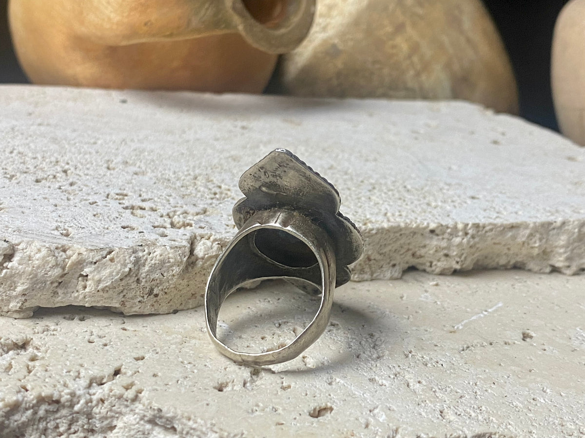 beautiful statement ring made by a Rajasthani village silversmith just outside of Jaipur. Sterling silver and blue ceramic beads with hand wired (not cast) filigree face decoration. Rajasthan, India. Looks great on a man's hand or woman's hand.   Measurements:  Face 4 cm x 2.5 cm Size 9.25 | 19.25 mm