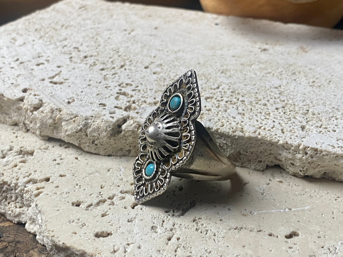 beautiful statement ring made by a Rajasthani village silversmith just outside of Jaipur. Sterling silver and blue ceramic beads with hand wired (not cast) filigree face decoration. Rajasthan, India. Looks great on a man's hand or woman's hand.   Measurements:  Face 4 cm x 2.5 cm Size 9.25 | 19.25 mm