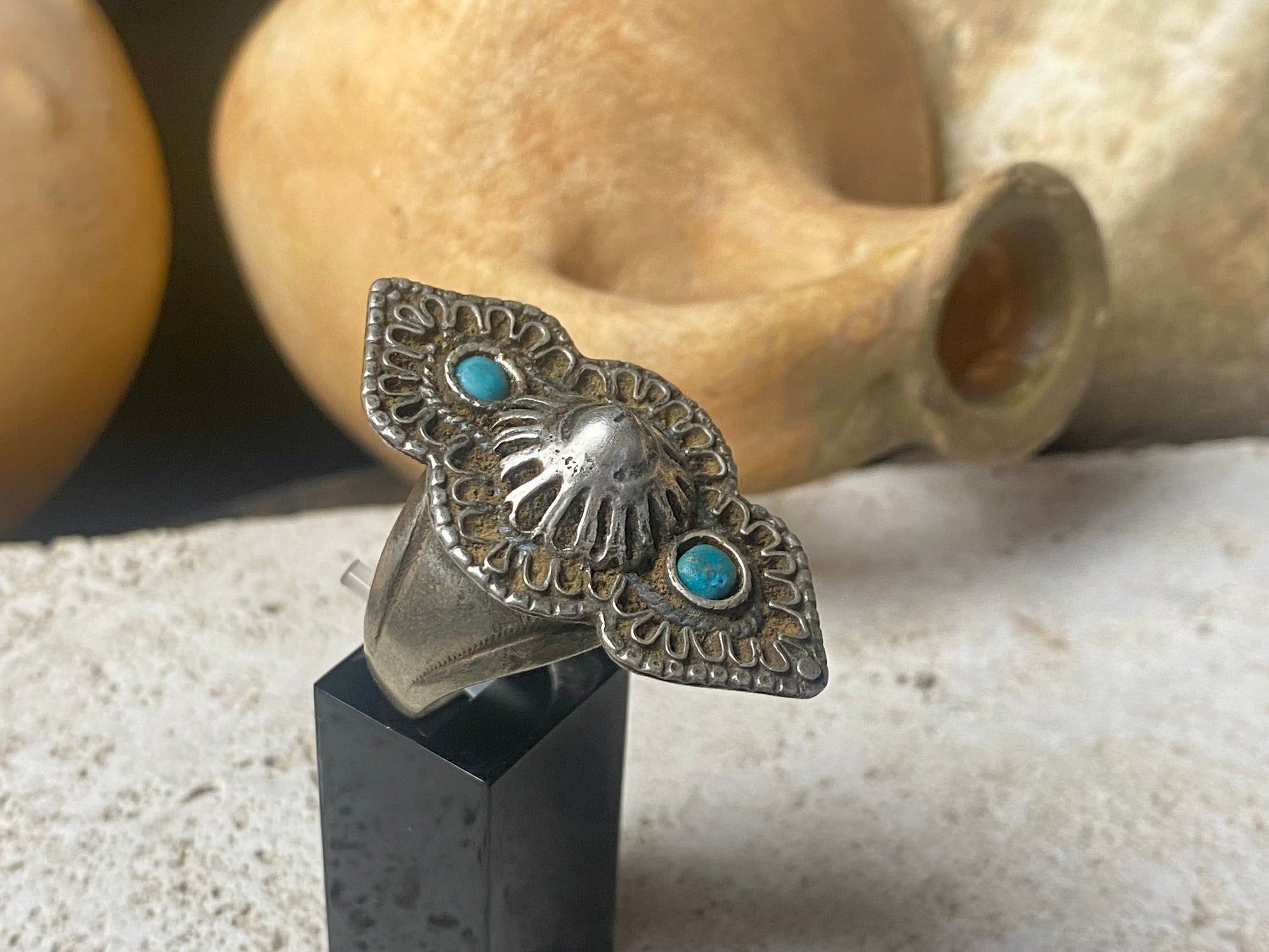 beautiful statement ring made by a Rajasthani village silversmith just outside of Jaipur. Sterling silver and blue ceramic beads with hand wired (not cast) filigree face decoration. Rajasthan, India. Looks great on a man's hand or woman's hand.   Measurements:  Face 4 cm x 2.5 cm Size 9.25 | 19.25 mm
