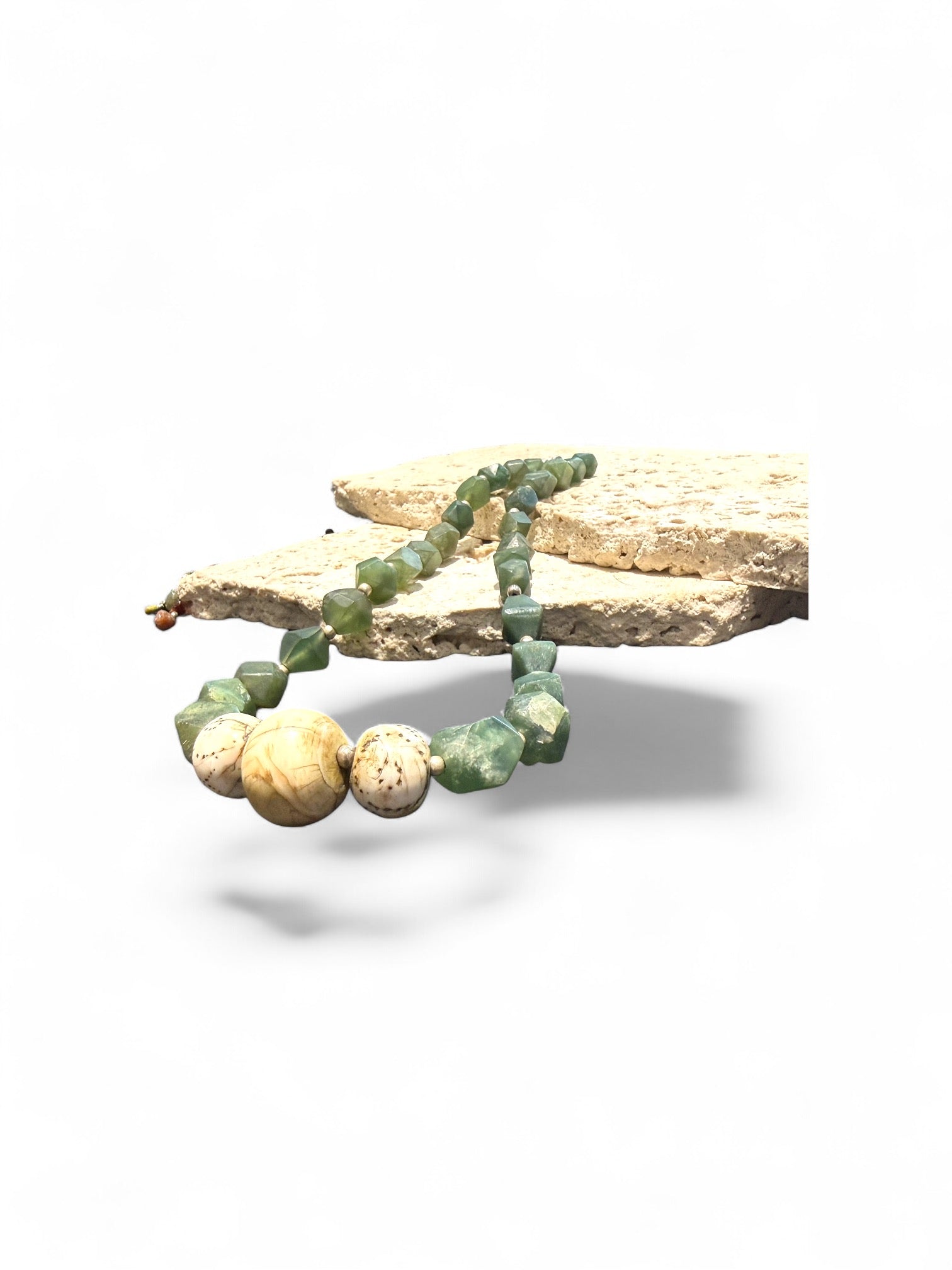 Sea green Afghan serpentine and incised vintage Naga shell beads, finished with sterling silver. Measurements: length 44.5 cm