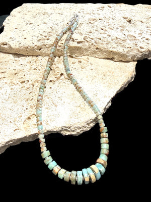 Choker necklace of graduated heshi cut pale blue amzonite, separated by sterling spacers. Sterling silver clasp. 42.5 cm length, beads 3-9 mm diameter