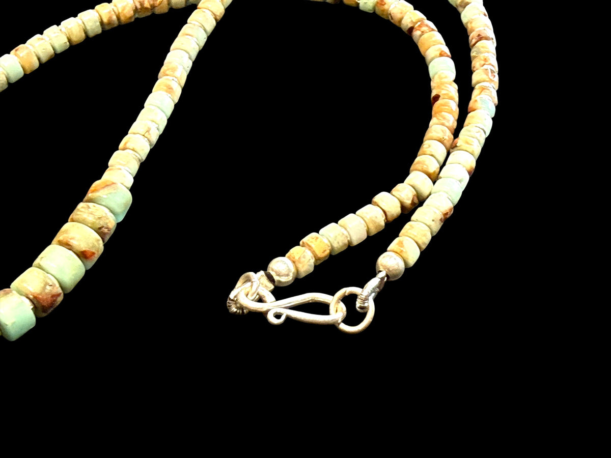 Choker necklace of graduated heshi cut pale blue amzonite, separated by sterling spacers. Sterling silver clasp. 42.5 cm length, beads 3-9 mm diameter