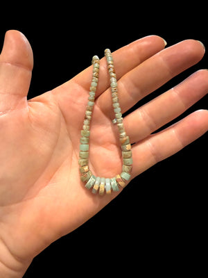 Choker necklace of graduated heshi cut pale blue amzonite, separated by sterling spacers. Sterling silver clasp. 42.5 cm length, beads 3-9 mm diameter