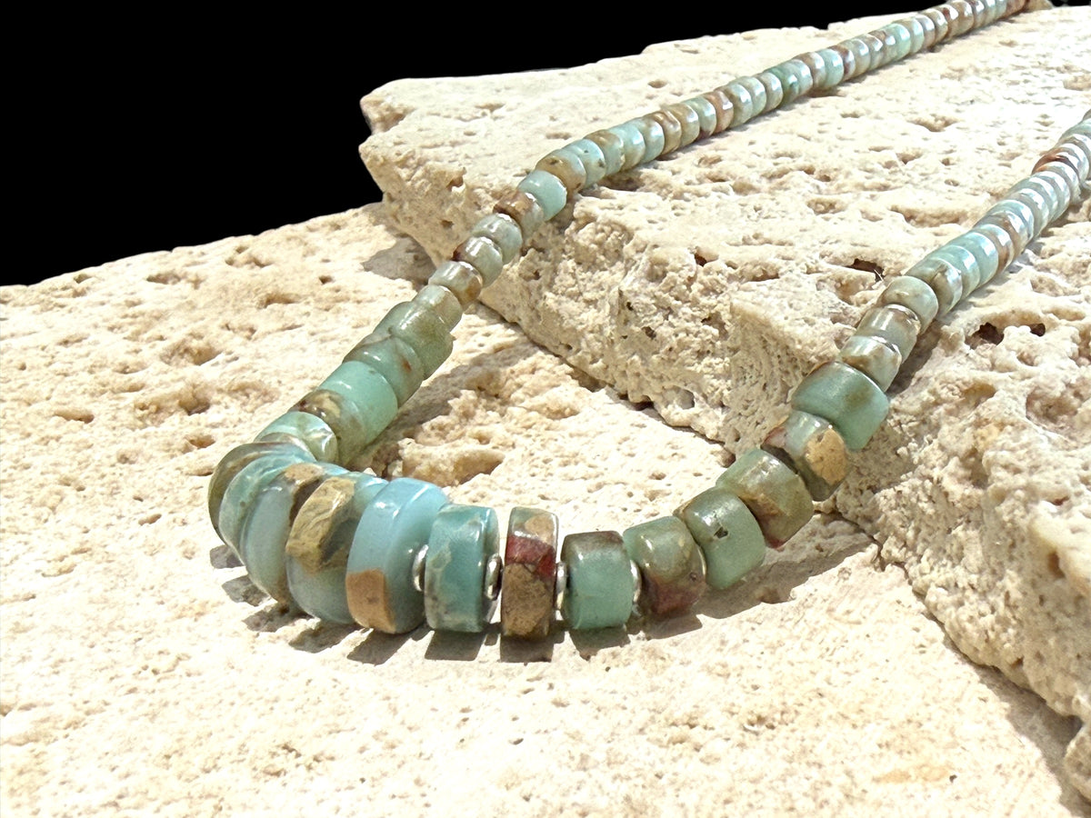 Choker necklace of graduated heshi cut pale blue amzonite, separated by sterling spacers. Sterling silver clasp. 42.5 cm length, beads 3-9 mm diameter