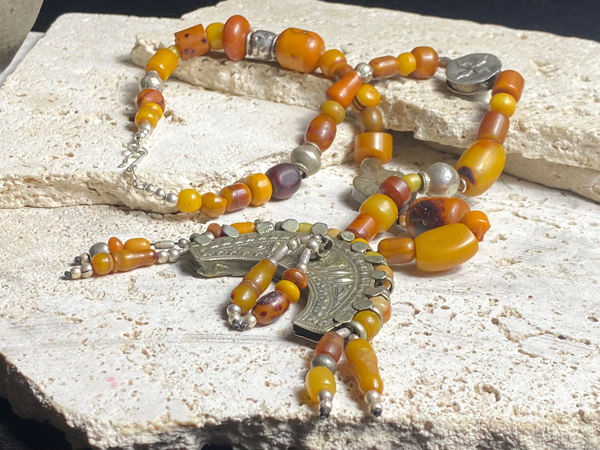 Antique Afghan prayer bead necklace with antique Tibetan silver pendant as centrepiece, plus antique Uzbek and old tribal silver beads. Length 61.5 cm