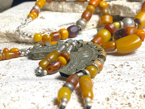 Antique Afghan prayer bead necklace with antique Tibetan silver pendant as centrepiece, plus antique Uzbek and old tribal silver beads. Length 61.5 cm