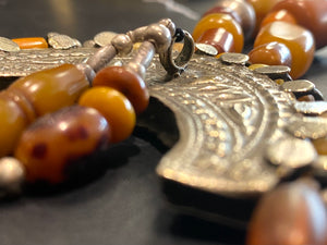 Antique Afghan prayer bead necklace with antique Tibetan silver pendant as centrepiece, plus antique Uzbek and old tribal silver beads. Length 61.5 cm