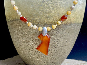 Amber fetish necklace features bird pendant, matt jasper & buffalo horn beads, highlighted with handmade silver. Our short necklace is unisex. Length 44 cm
