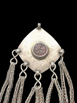 High grade silver plaque pendant with centre resin "gem" with unknown inscription, chains and leaf dangles. Afghanistan. Early to mid 20th century. Measurements: height 12 cm