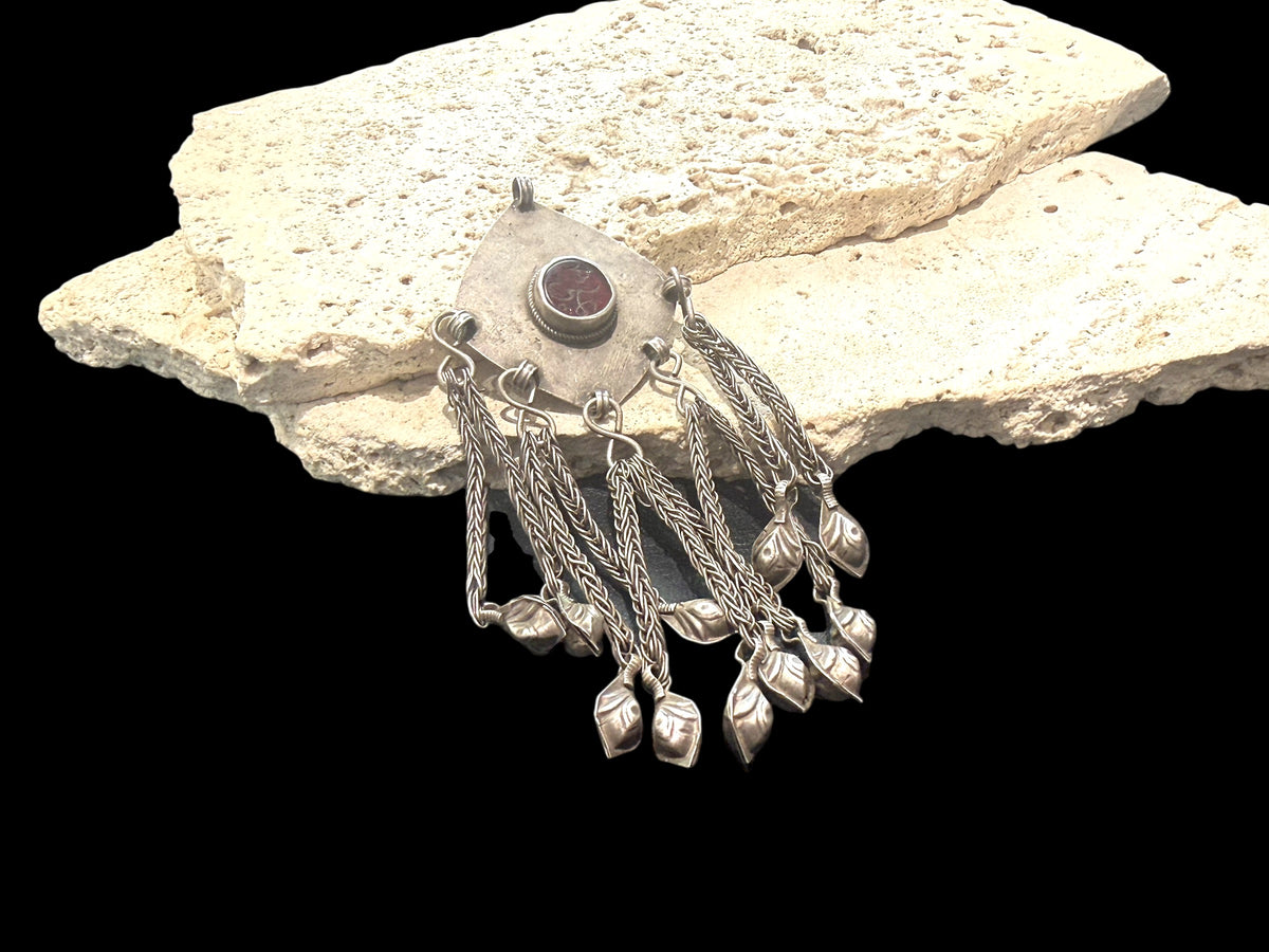 High grade silver plaque pendant with centre resin "gem" with unknown inscription, chains and leaf dangles. Afghanistan. Early to mid 20th century. Measurements: height 12 cm