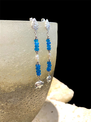 Apatite earrings with pearl detailing, finished with sterling silver elephant charms. Sterling post and butterfly mount. Measurements: 6 cm height