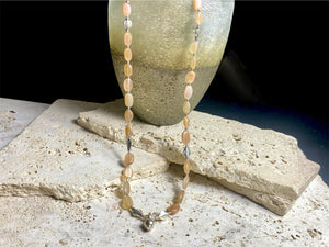 Long necklace made from apricot moonstone with handmade sterling silver Indian beads and centrepiece. A lovely necklace for any occasion. Length: 57.5 cm
