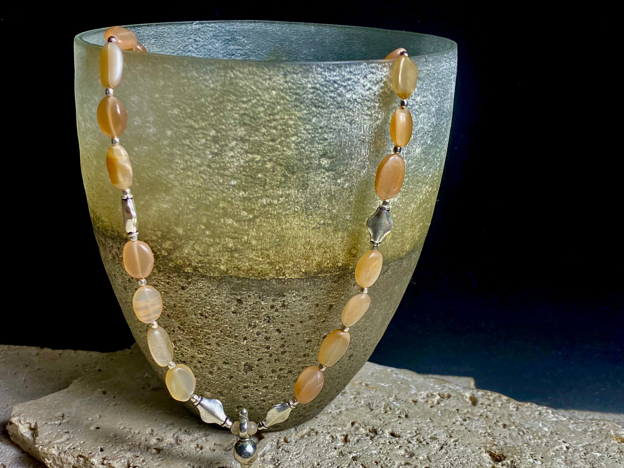 Long necklace made from apricot moonstone with handmade sterling silver Indian beads and centrepiece. A lovely necklace for any occasion. Length: 57.5 cm
