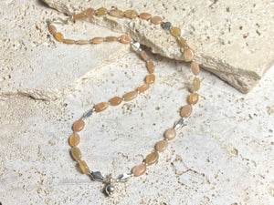 Long necklace made from apricot moonstone with handmade sterling silver Indian beads and centrepiece. A lovely necklace for any occasion. Length: 57.5 cm
