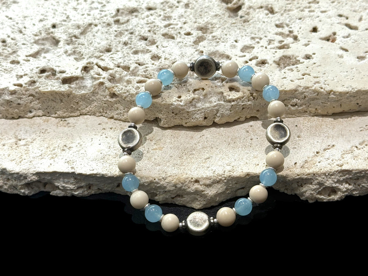 Beaded bracelet of aquamarine, jasper, vintage silver and sterling silver spacer beads. Strung on sturdy elastic cord. Size 18 cm. Beads 6 mm diameter