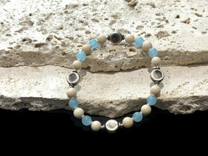 Beaded bracelet of aquamarine, jasper, vintage silver and sterling silver spacer beads. Strung on sturdy elastic cord. Size 18 cm. Beads 6 mm diameter