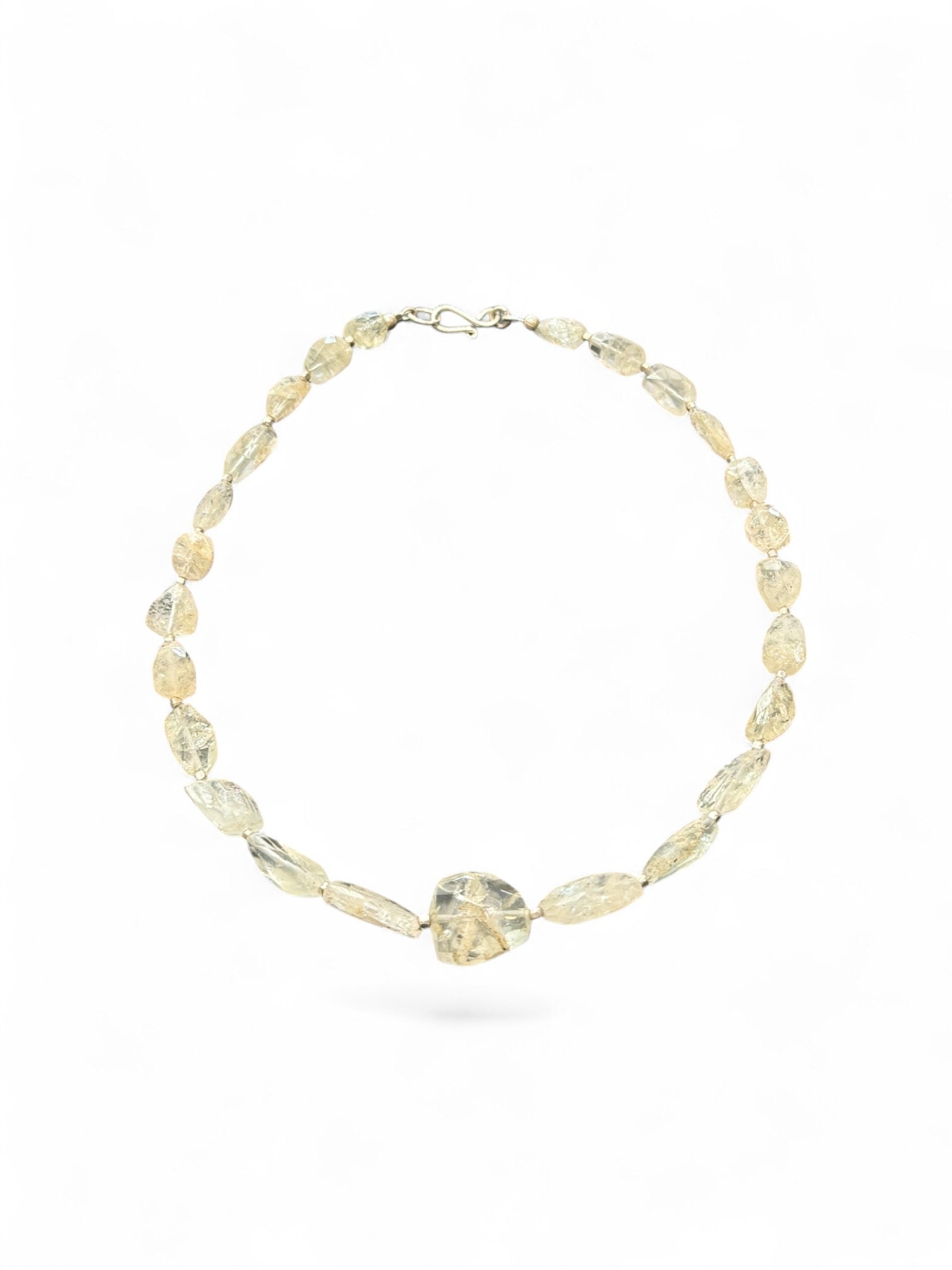 Aquamarine choker. The stones are a pale white-yellow-green and the necklace features silver bead detailing. Sterling silver hook and findings. 40.7 cm length