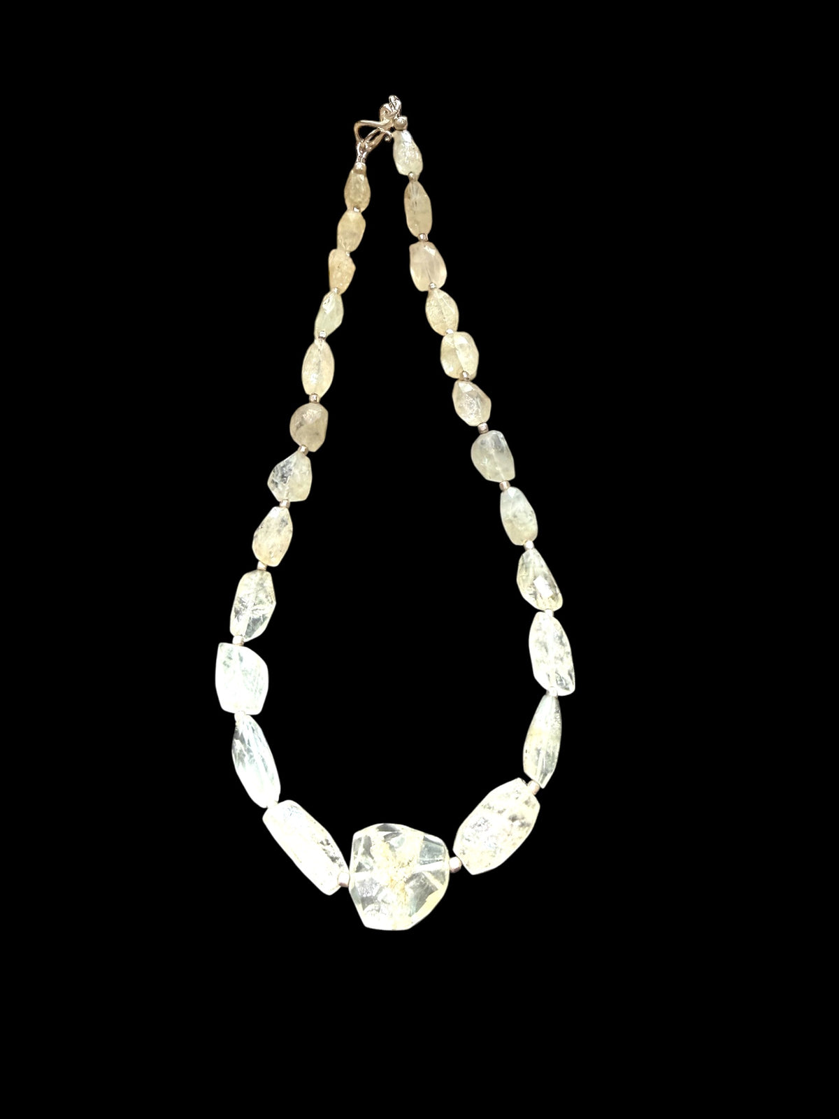 Aquamarine choker. The stones are a pale white-yellow-green and the necklace features silver bead detailing. Sterling silver hook and findings. 40.7 cm length
