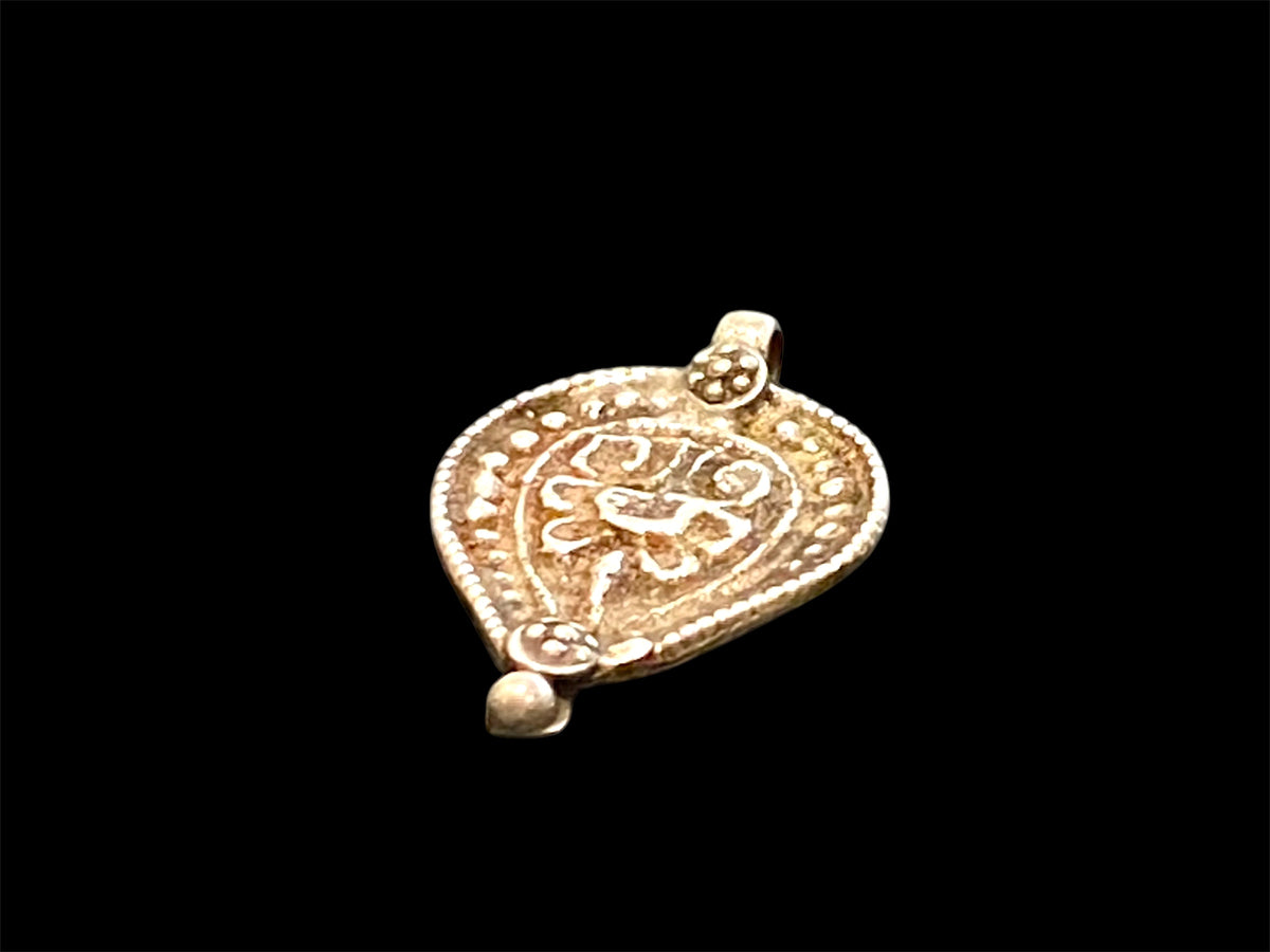 Aramudi pendant, silver, southern India. Protective, represents the power of women. Mid 20th C. Measurements: height 3 cm, width 2 cm