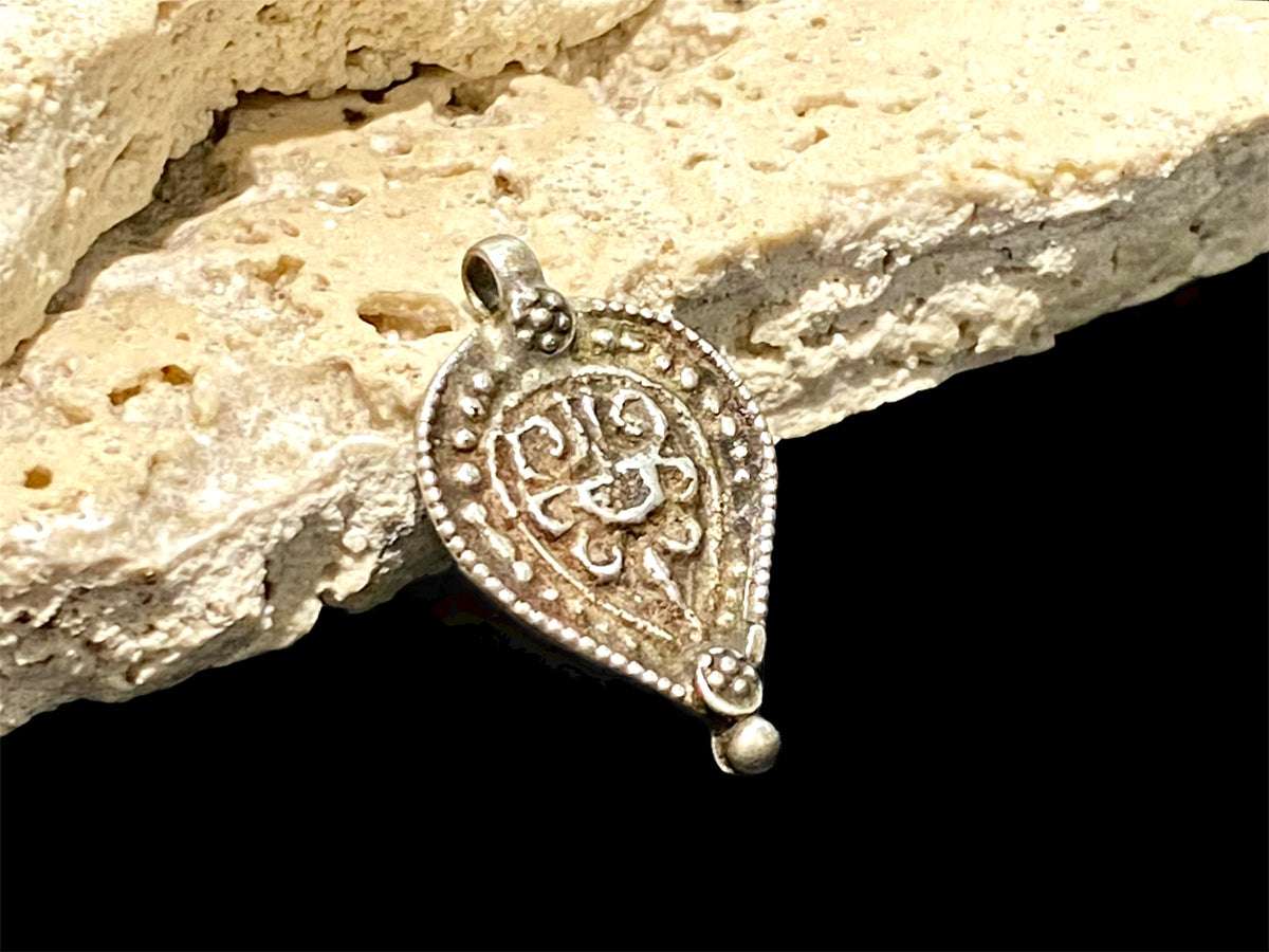 Aramudi pendant, silver, southern India. Protective, represents the power of women. Mid 20th C. Measurements: height 3 cm, width 2 cm