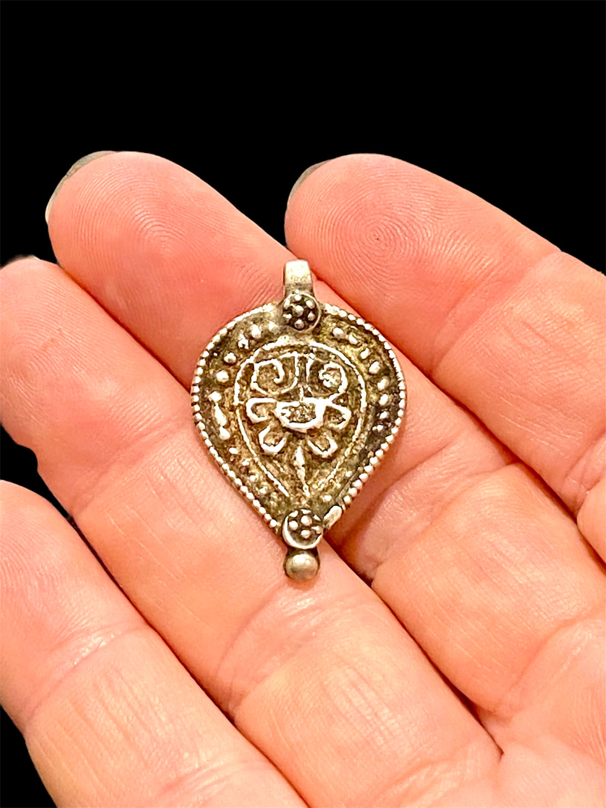 Aramudi pendant, silver, southern India. Protective, represents the power of women. Mid 20th C. Measurements: height 3 cm, width 2 cm