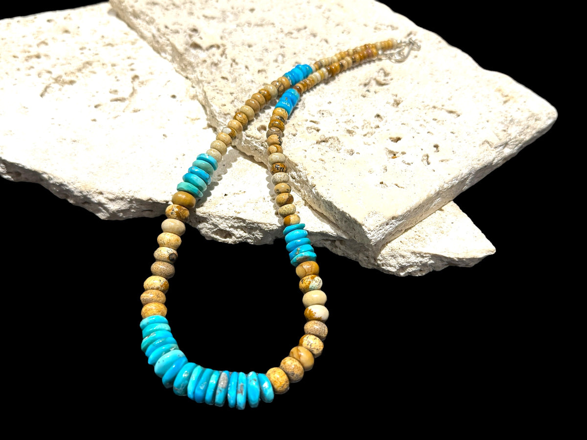 Southwest style necklace of graduated Arizonian turquoise & rondel cut jasper beads. The necklace is finished with a sterling silver hook clasp. Length 45.5 cm