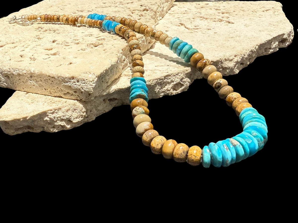 Southwest style necklace of graduated Arizonian turquoise & rondel cut jasper beads. The necklace is finished with a sterling silver hook clasp. Length 45.5 cm