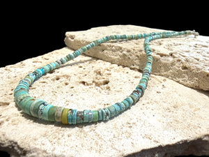 Graduated turquoise choker necklace featuring heshi beads of pale blue Arizona turquoise. Finished with a sterling silver hook clasp. 41 cm (16.25") length