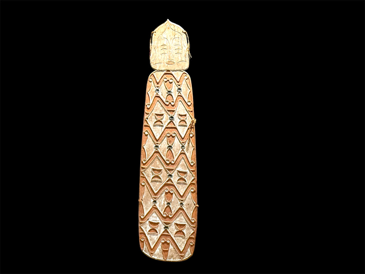 Asmat shield. Wood carved and decorated with lime, ochre, charcoal and sago fibre. Central Asmat region, Irian Jaya. Length 166 cm x 42 cm. Yartzhaus Collection