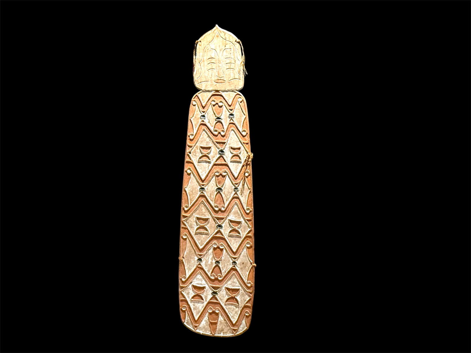 Asmat shield. Wood carved and decorated with lime, ochre, charcoal and sago fibre. Central Asmat region, Irian Jaya. Length 166 cm x 42 cm. Yartzhaus Collection