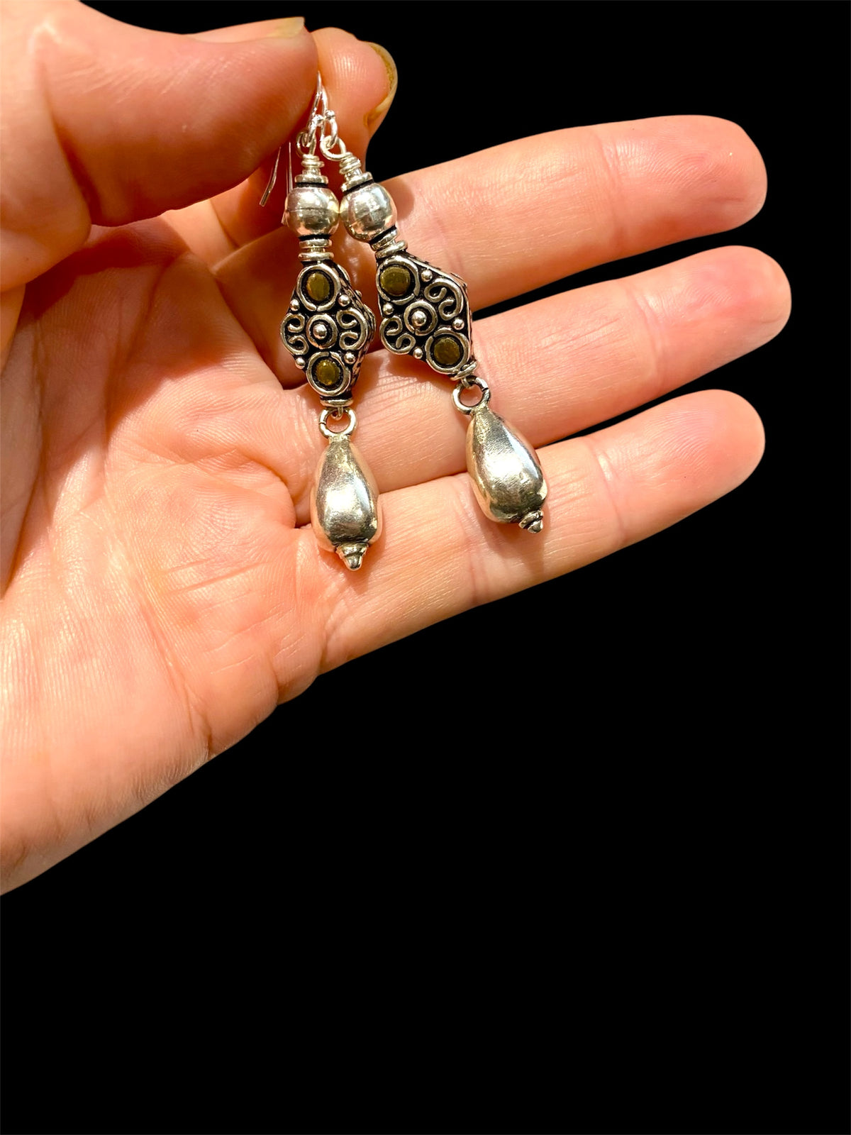 Lush baroque earrings are large in size but easy to wear. Sterling silver handmade beads, the centrepiece of which features gold look detailing in brass. Length including hook 6 cm