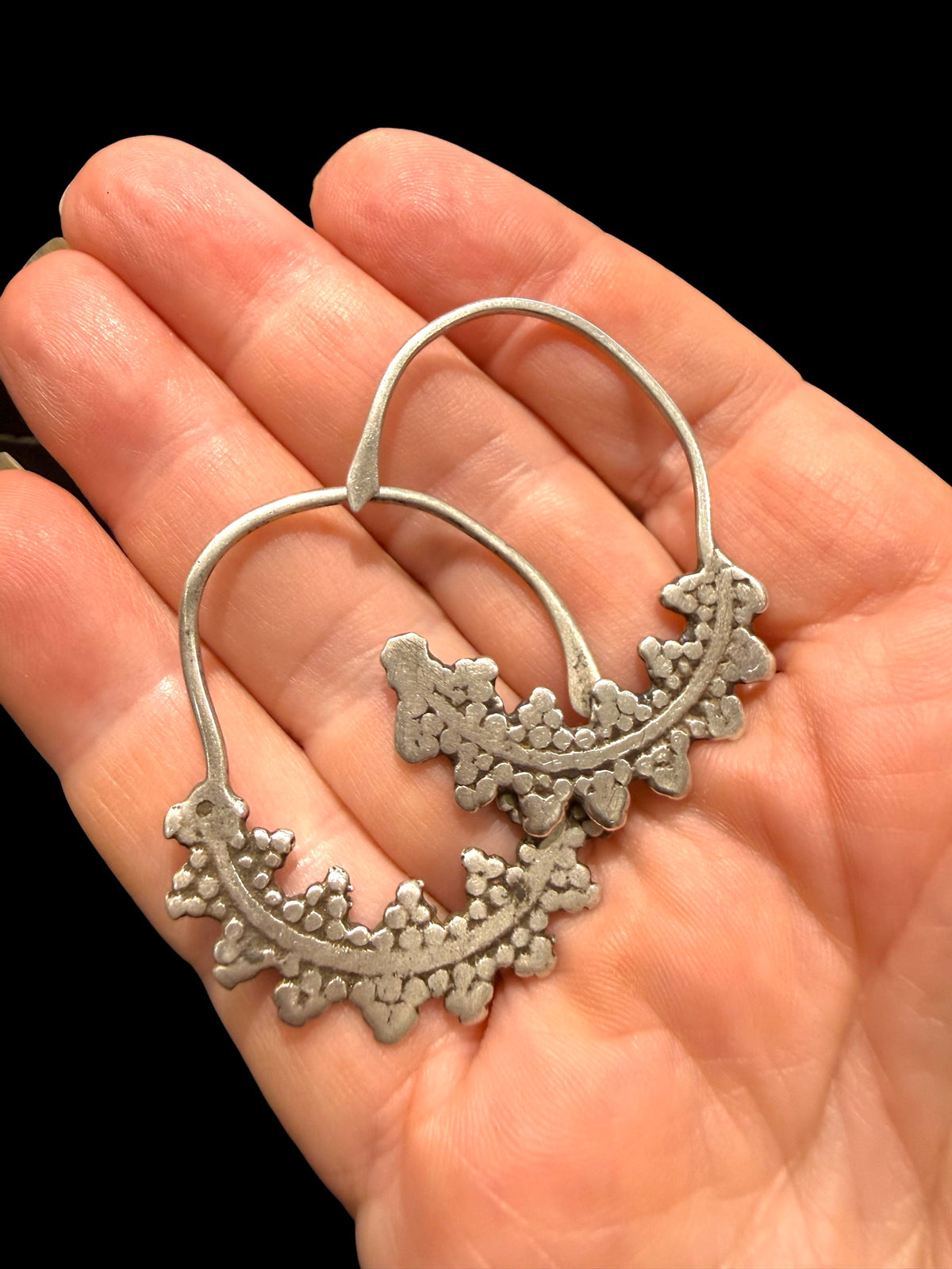 Berber hoop earrings with ornamented crescent edged with trefoil projections. High grade silver. Tunisia. Early 20th C or earlier. Width 3 cm, height 4.2 cm