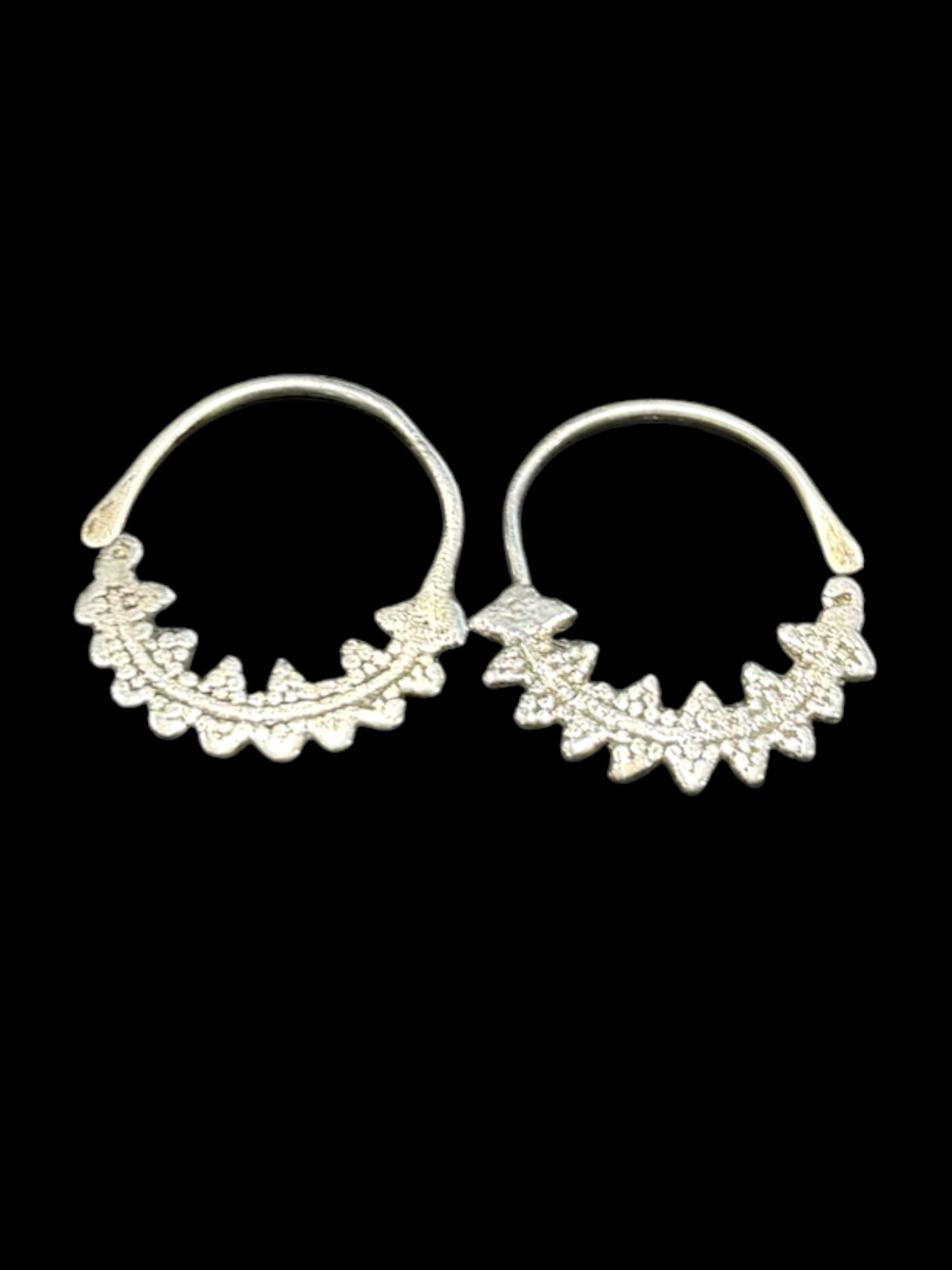 Berber open hoop earrings with ornamented crescent edged with trefoil projections. High grade silver. Tunisia. Early 20th century or earlier. Diameter 3.7 cm