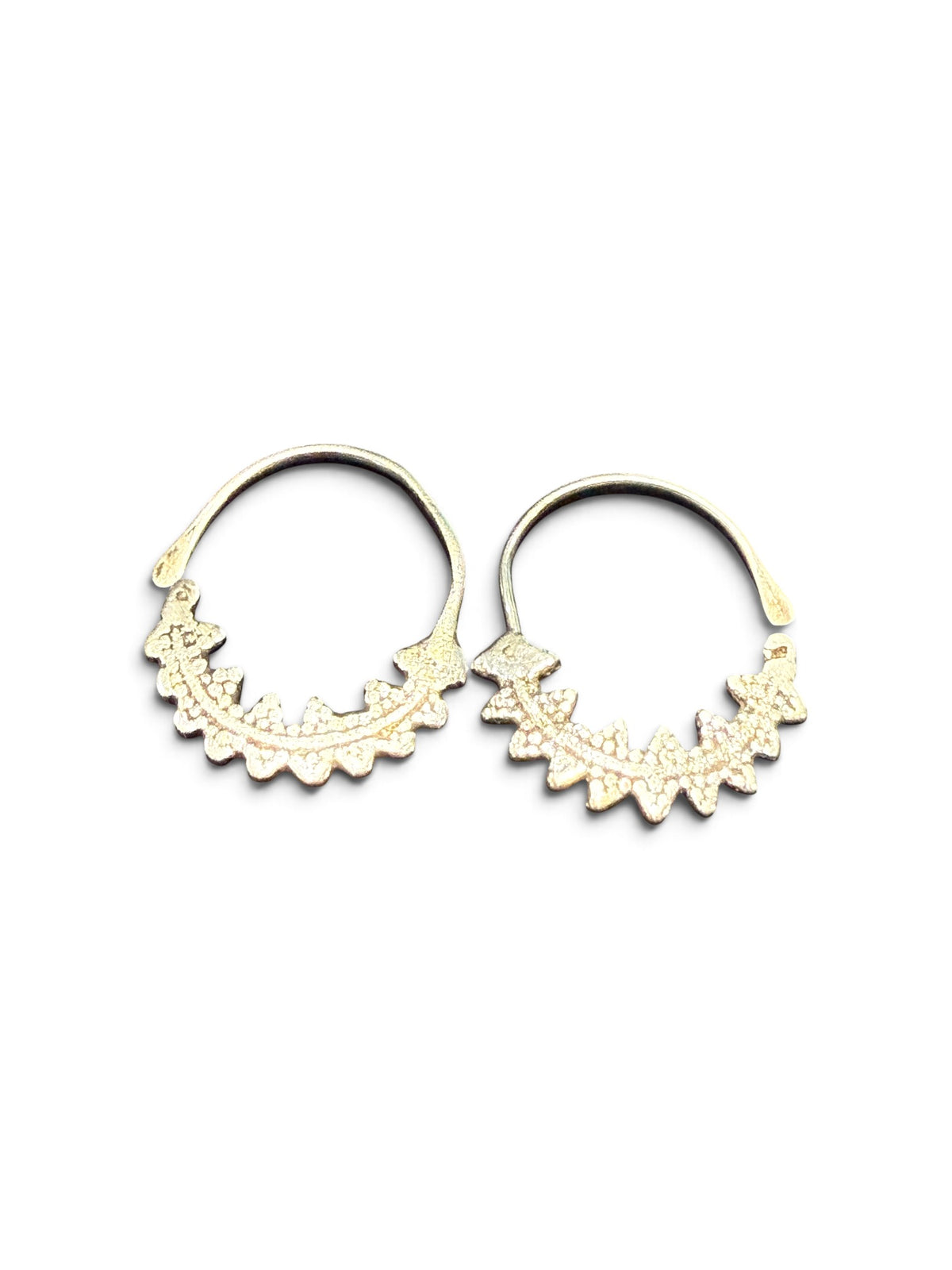 Berber open hoop earrings with ornamented crescent edged with trefoil projections. High grade silver. Tunisia. Early 20th C. Height 4.1 cm, width 3.7 cm