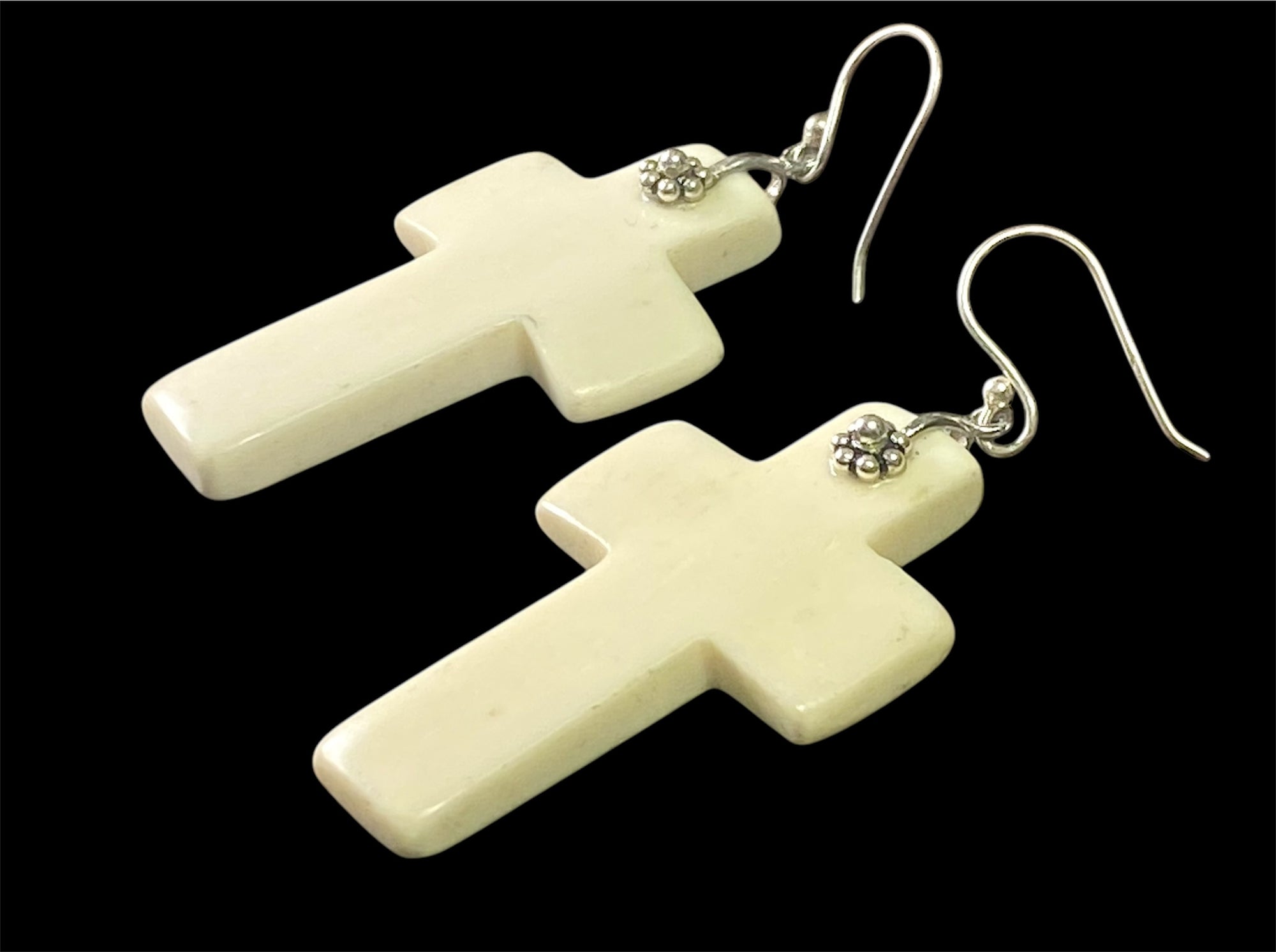 Stylish cross earrings with a southwest vibe. Hand carved cow bone, sterling silver detailing and hooks. Light and easy to wear. Drop including hook 6.5 cm