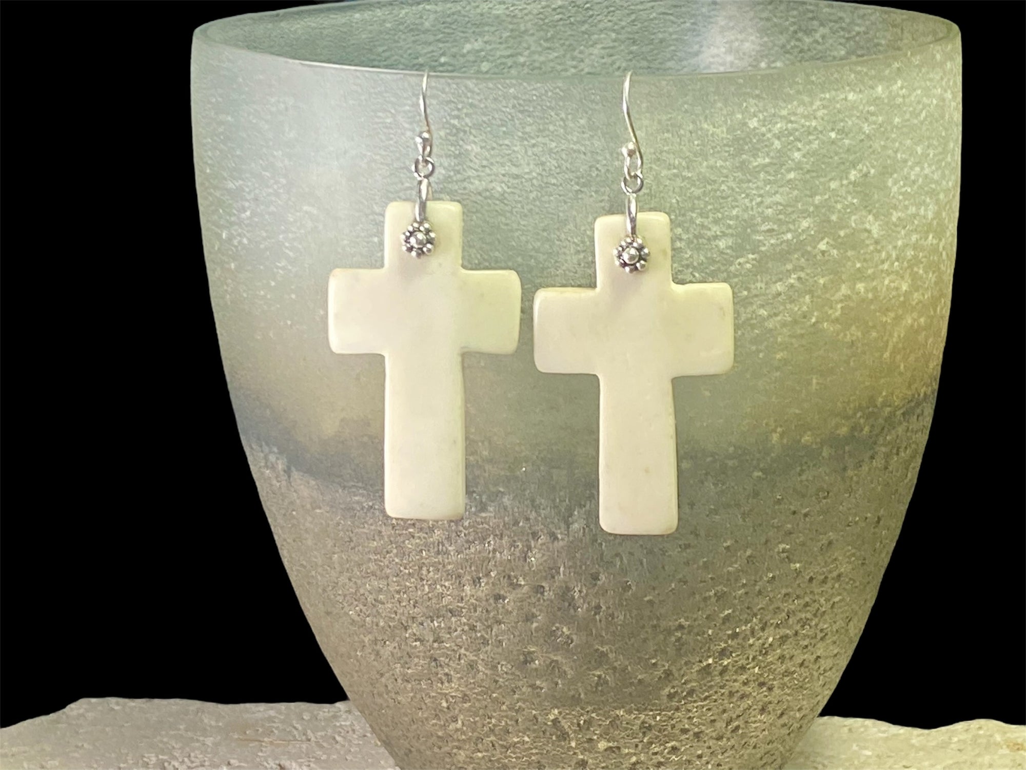 Stylish cross earrings with a southwest vibe. Hand carved cow bone, sterling silver detailing and hooks. Light and easy to wear. Drop including hook 6.5 cm