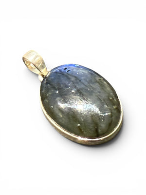 Large oval labradorite pendant set in sterling silver with a generous bail. A high set stone with excellent colour. Height 4.2 cm, width 2.3 cm, height 1 cm